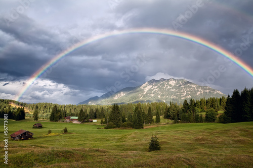 rainbow over Karwendel Alps and meadows