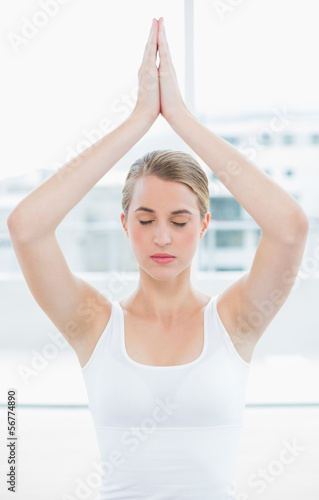 Peaceful fit woman doing yoga session