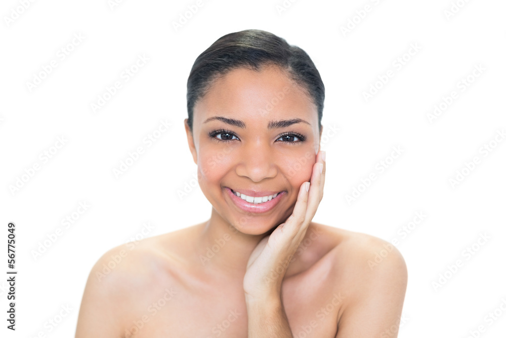 Joyful young dark haired model touching her cheek Joyful young dark haired model touching her cheek