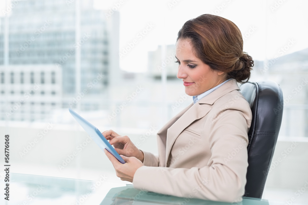 Content businesswoman looking at tablet Content businesswoman looking at tablet