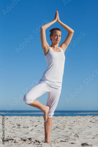 Woman in tree yoga pose