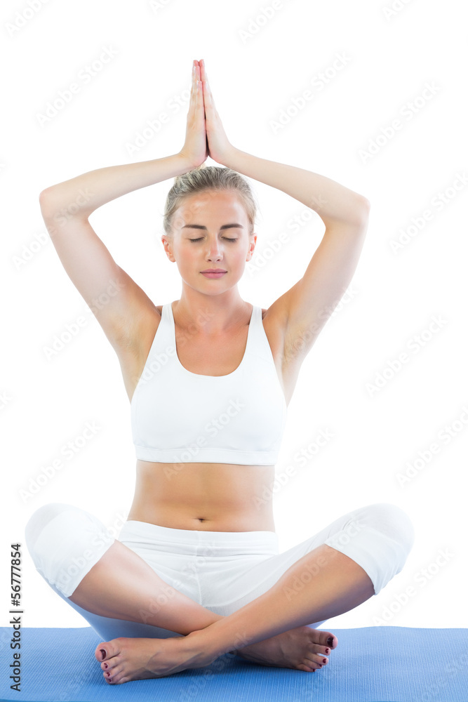 Toned calm blonde sitting in lotus pose meditating Toned calm blonde sitting in lotus pose meditating