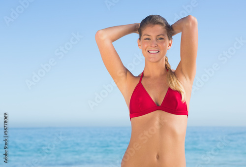 Cheerful attractive blonde posing in bikini