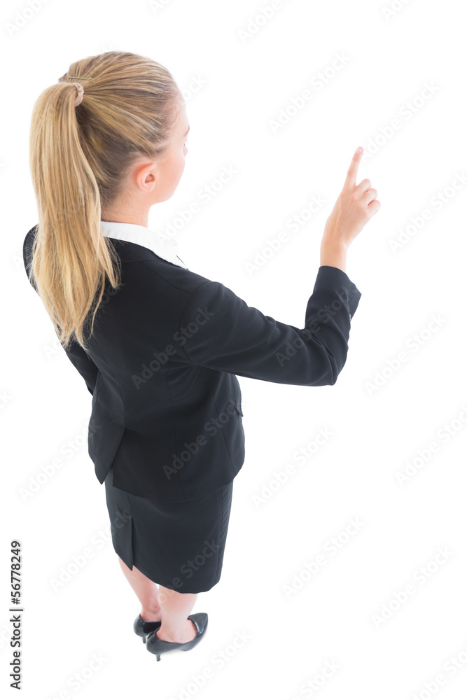 High angle view of young business woman pointing High angle view of young business woman pointing