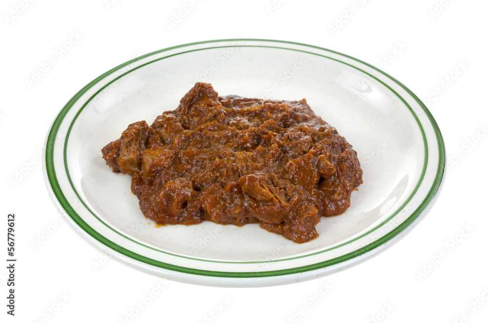 Chipped barbecue pork in thick gravy on a plate