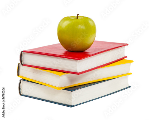 Back to school. Books and apple isolated on white background
