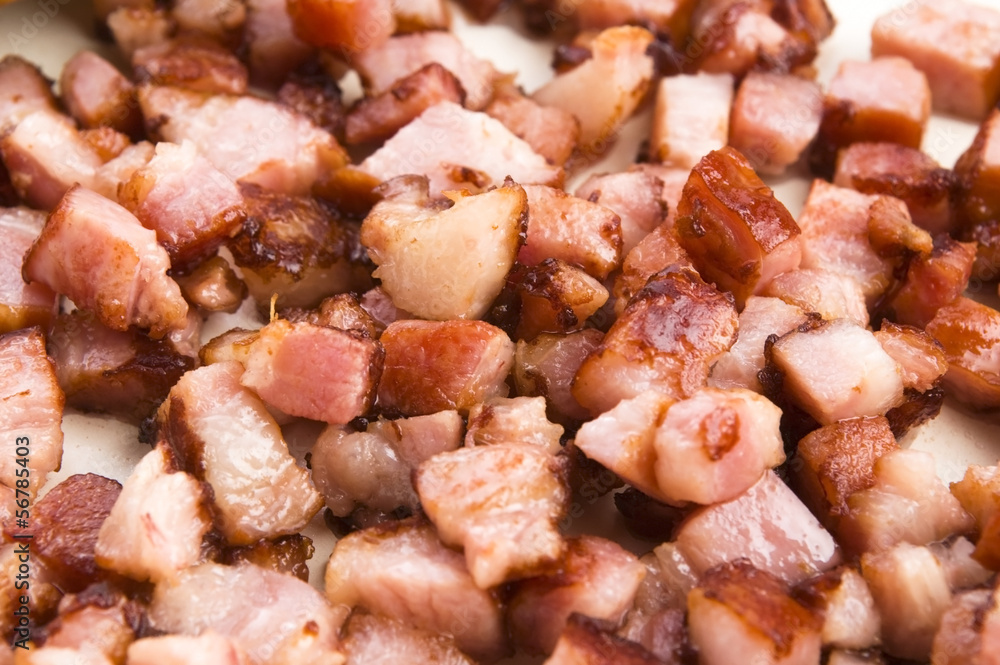 Macro photo of bacon being fried in a pan Macro photo of bacon being fried in a pan