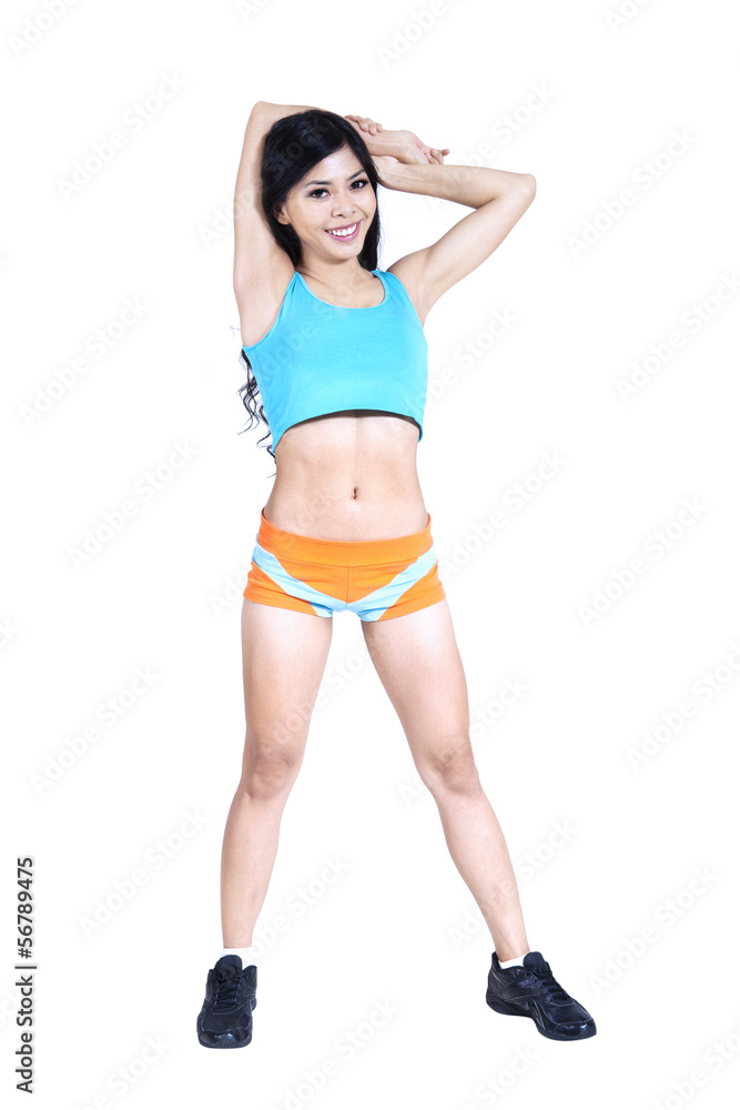 Beautiful fitness woman stretching isolated on white Beautiful fitness woman stretching isolated on white