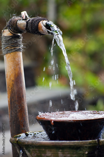 fresh water drops in a cup, Bali, Indonesia photo