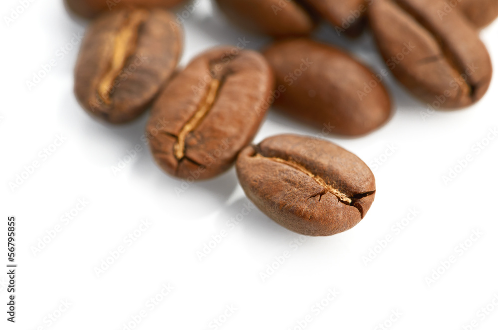 Macro of coffee beans isolated on white background Macro of coffee beans isolated on white background