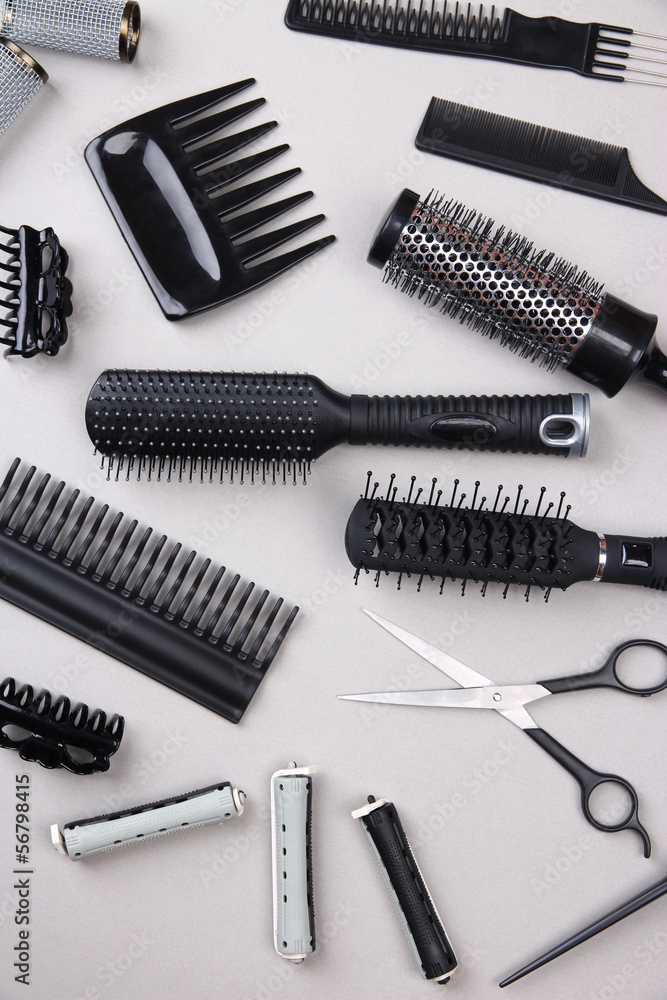 Professional hairdresser tools on gray background Professional hairdresser tools on gray background