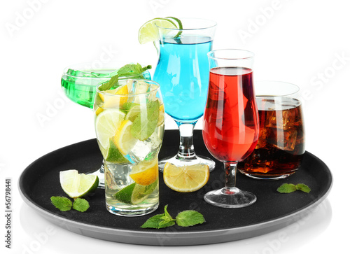 Many glasses of cocktails on tray, isolated on white