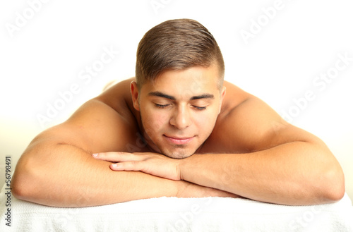 Young man relaxed in spa salon
