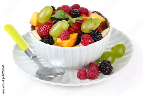 Fruit salad in bowl  isolated on white