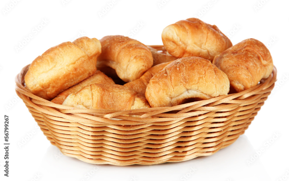 Tasty croissants in wicker basket isolated on white Tasty croissants in wicker basket isolated on white