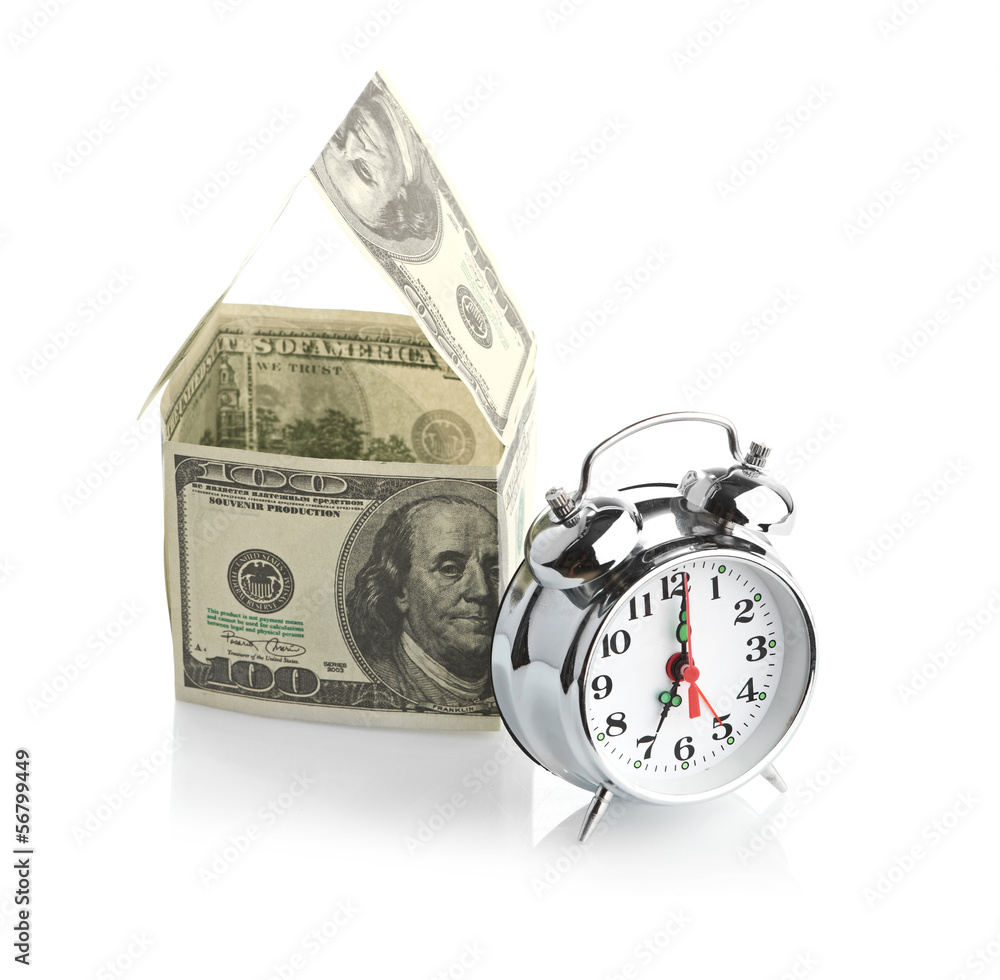 house made of dollars and alarm clock. house made of dollars and alarm clock.
