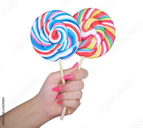 Woman hand golding two lollipops