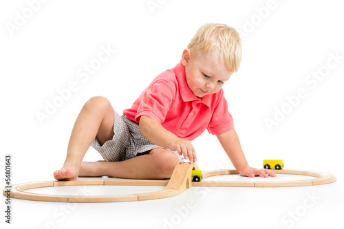 child playing rail road toy