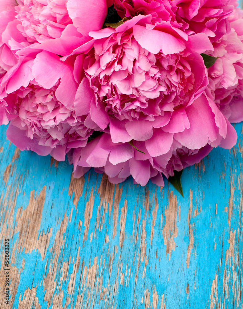 bunch of peonies on wooden surface bunch of peonies on wooden surface