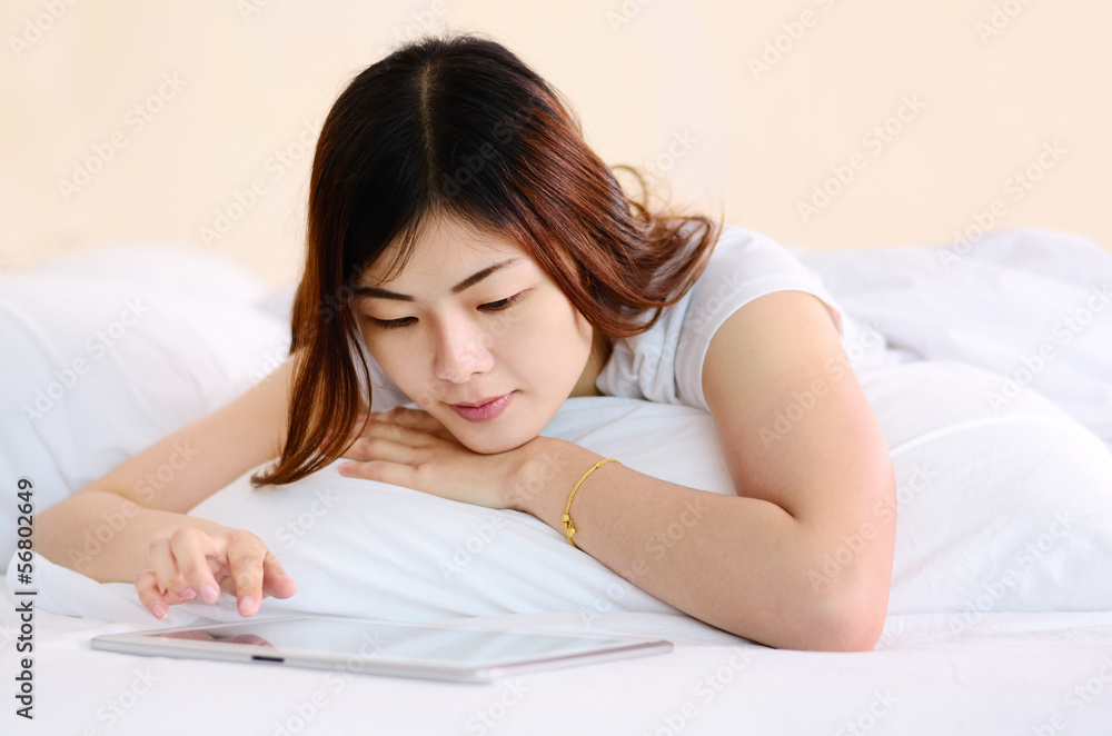 Asian teenage reading and chat with cellphone Asian teenage reading and chat with cellphone
