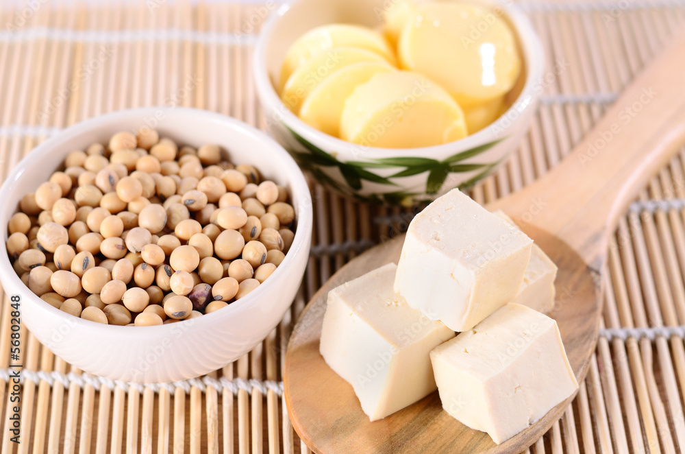 Fresh tofu and soybean product on bamboo background