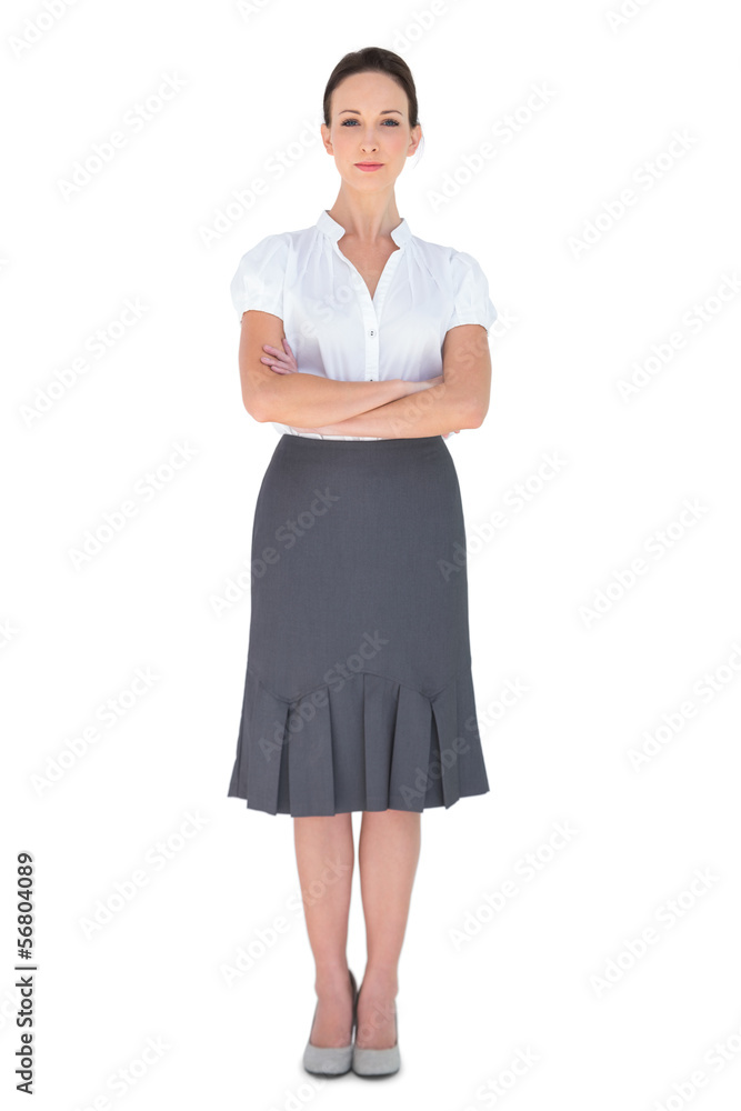 Peaceful businesswoman posing crossing arms Peaceful businesswoman posing crossing arms
