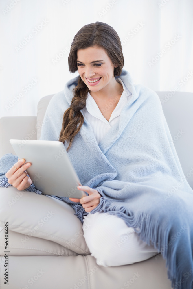 Beautiful casual brown haired woman in white pajamas shopping on Beautiful casual brown haired woman in white pajamas shopping on
