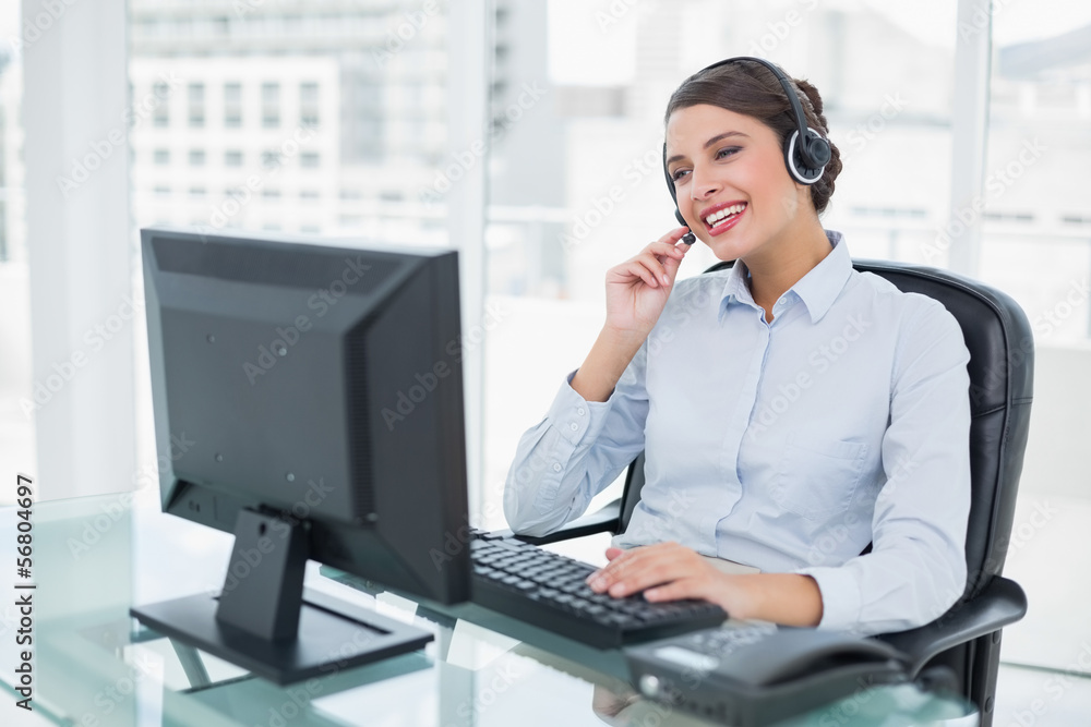 Joyful classy brown haired operator answering a call Joyful classy brown haired operator answering a call