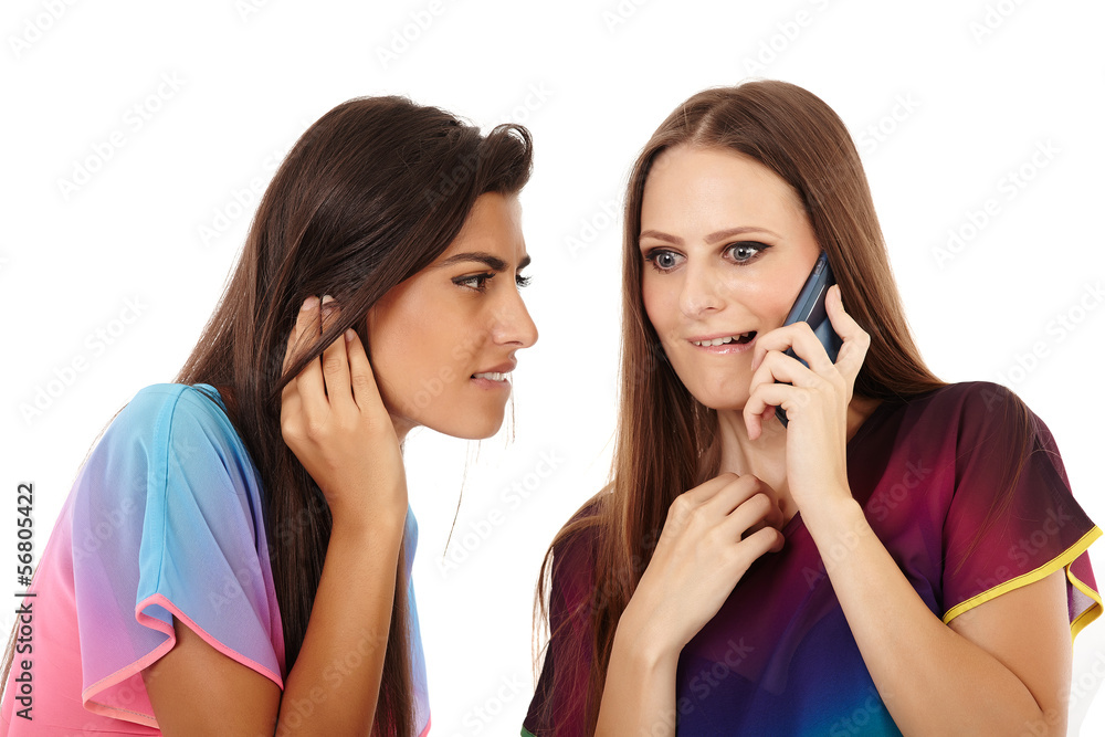 Girlfriends having fun with the mobile phone Girlfriends having fun with the mobile phone