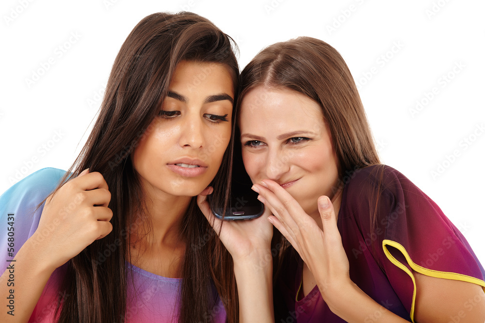 Girlfriends having fun with the mobile phone Girlfriends having fun with the mobile phone