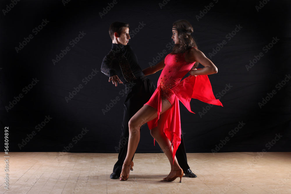 Fototapeta premium Latino dancers in ballroom isolated on black background