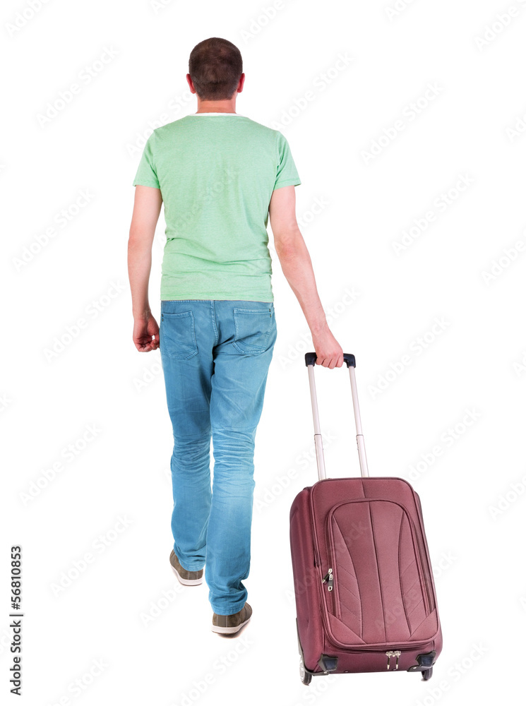back view of walking man with suitcase. back view of walking man with suitcase.