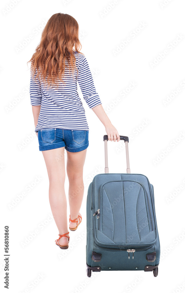 back view of walking woman with suitcase back view of walking woman with suitcase