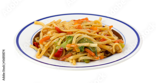 A meal of noodles and vegetables on a small dish