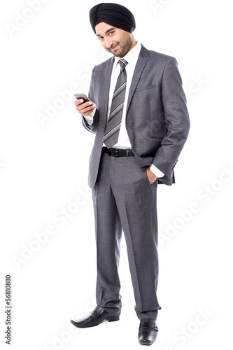 Male executive sending text message