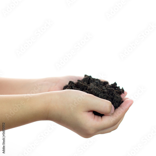Soil on girl hand over white background