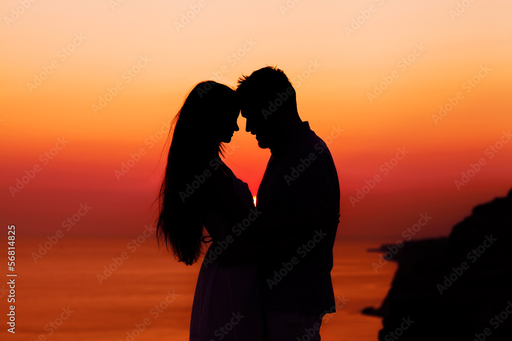 silhouette of a loving couple at sunset