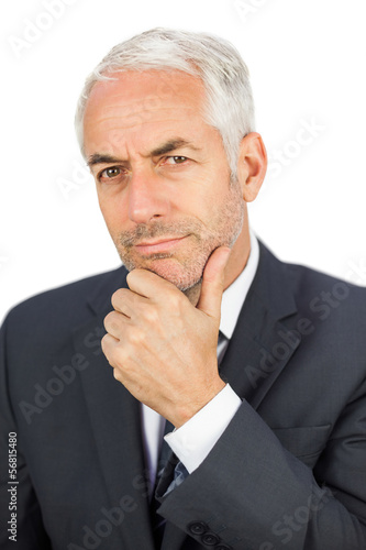 Focused businessman looking at camera