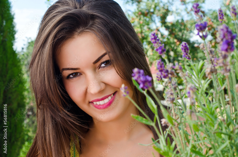 Beautiful woman in the garden with a bouquet of lavender Beautiful woman in the garden with a bouquet of lavender