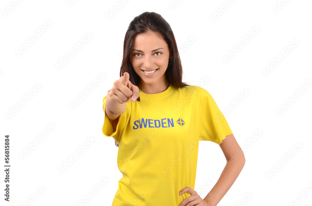 Girl pointing in front to you.Sweden flag on her yellow t-shirt Girl pointing in front to you.Sweden flag on her yellow t-shirt