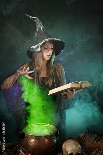 Halloween witch cooking a potion in a cauldron