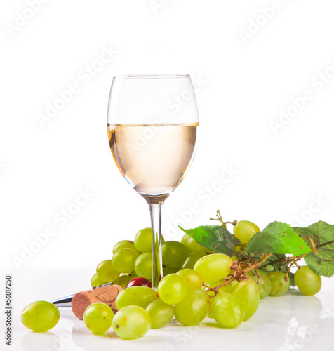 wineglass with white wine and grape isolated on white background