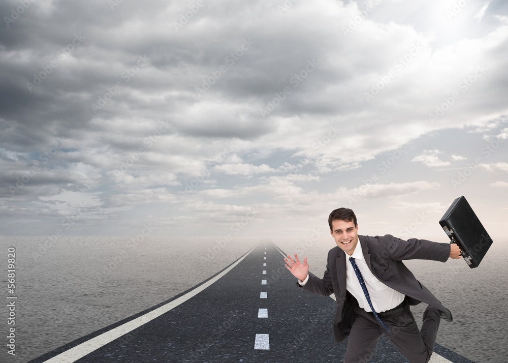 Happy businessman holding a briefcase and running Happy businessman holding a briefcase and running