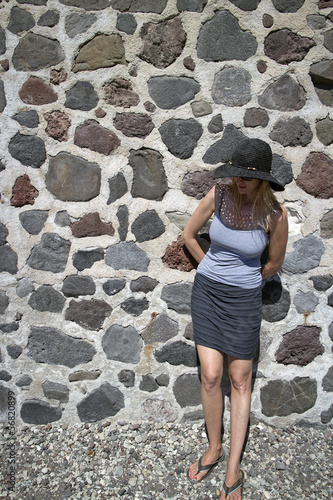 woman over stonewall © gdvcom