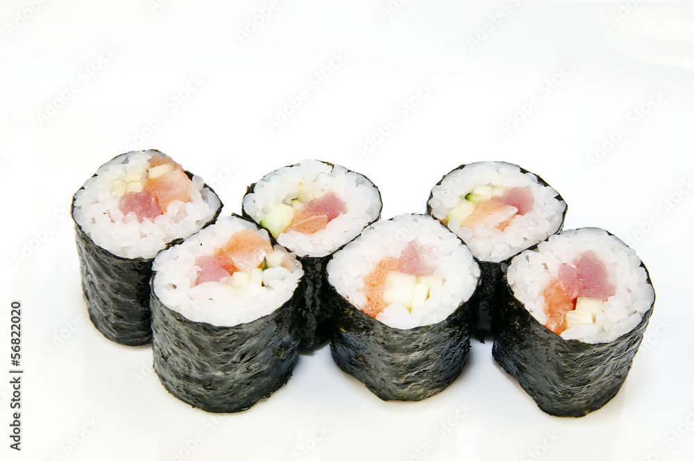 Japanese rolls in a restaurant with fish and vegetables Japanese rolls in a restaurant with fish and vegetables
