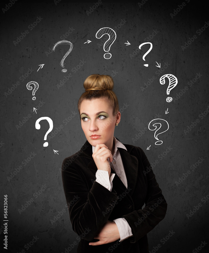 Young woman thinking with question mark circulation around her h Young woman thinking with question mark circulation around her h