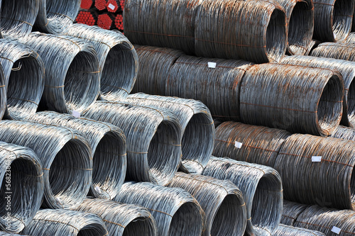 Stacked steel wire roll and pipe, ready for shipment in port