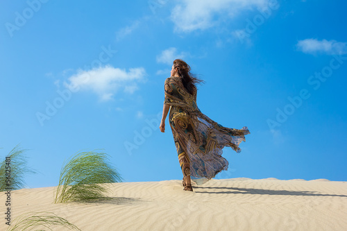 Beautiful Woman on the Sand Dune. Oasis of Calm
