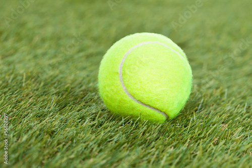 Tennis Ball On Green Pitch