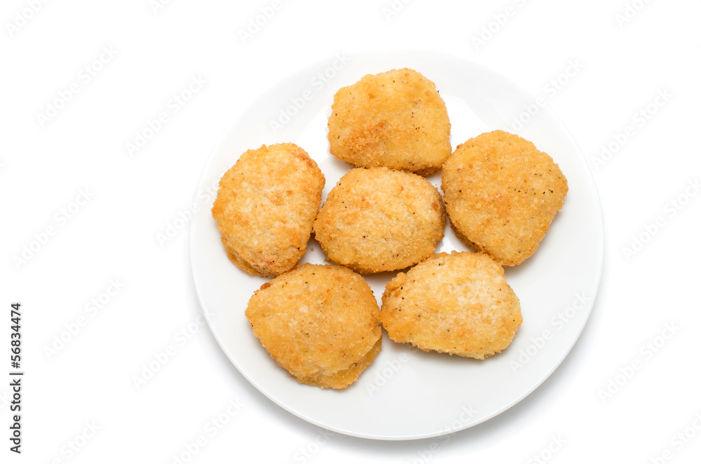 Fried chicken nuggets on a ceramic dish